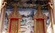 Thailand: Hell murals and elaborate windows on main viharn at Wat Phra Nang Sang, Phuket